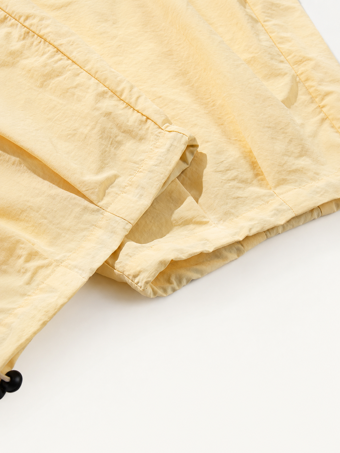 OYL-Lab Crinkle Embroidery Parachute Pants